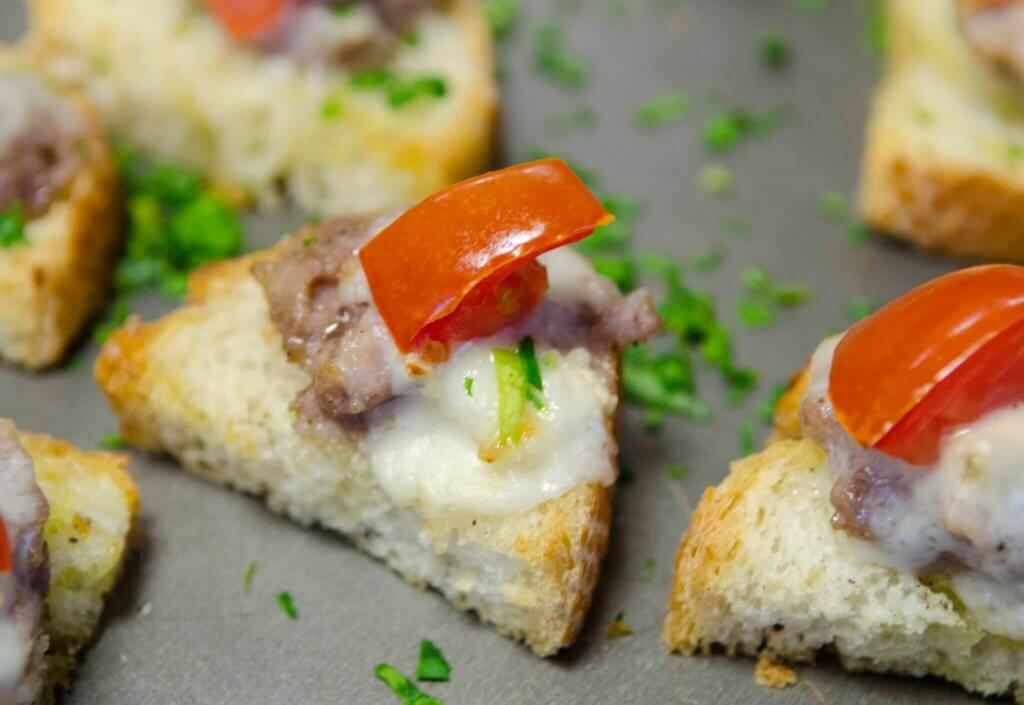 Sausage Gorgonzola and Tomato Crostini